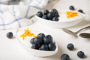 Yogurt with fresh blueberries and orange zest