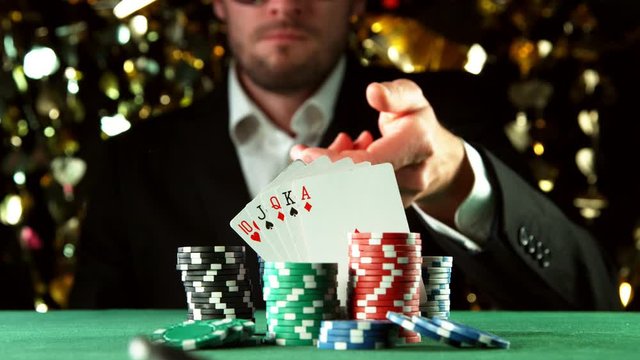 Super slow motion of poker player throwing chip towards camera. Filmed on high speed cinema camera, 1000fps.