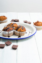 chocolate cupcakes, old white wooden table