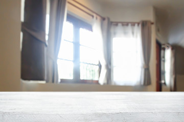 Fototapeta premium Empty wooden desk space over curtain and window background for product presentation.