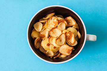 Homemade vanilla tiny pancake cereal in a bowl.