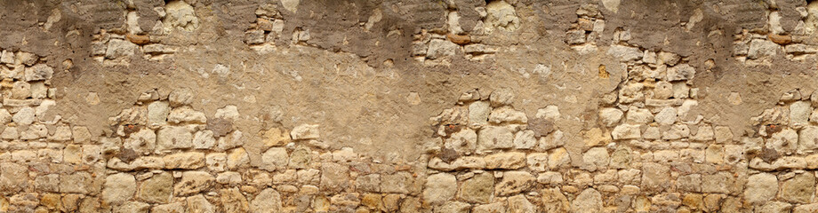 seamless horizontal texture of an old wall made of rubble stone, brown sandstone, with the remains...