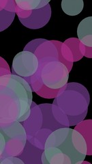 Multicolored translucent circles on a dark background. 3D illustration