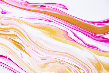 Fluid art texture. Abstract backdrop with mixing paint effect. Liquid acrylic artwork with flows and splashes. Mixed paints for background or poster. Coral, golden and white overflowing colors