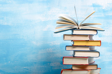 Law concept - Open law book with a wooden judges gavel on table in a courtroom or law enforcement office isolated on white background. Copy space for text