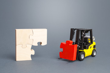 A forklift truck picks up the missing puzzle piece. Organization and systematization, step by step...