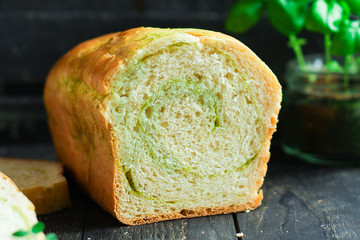 Bread roll with spinach and herbs homemade baking healthy eating. food background top view copy space for text