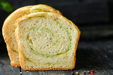 Bread roll with spinach and herbs homemade baking healthy eating. food background top view copy space for text