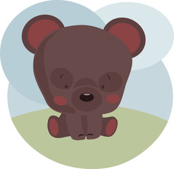 Fototapeta premium image of a little cute teddy bear on a background of green lawn and blue sky