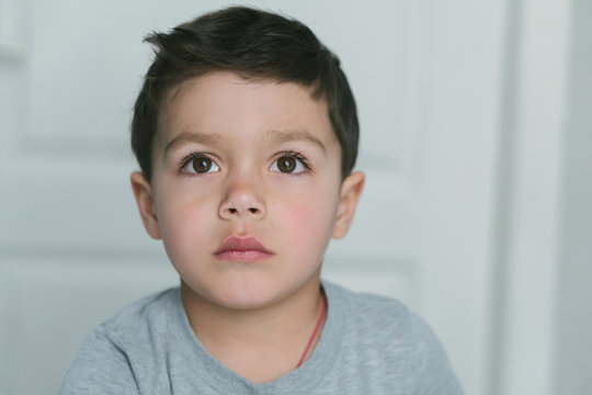 Pensive Toddler Boy Thinking At Home