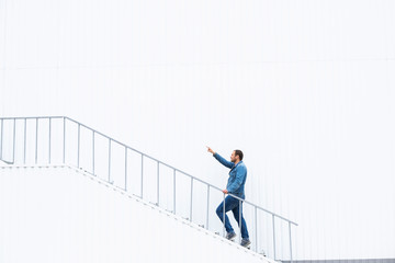 A man goes up the stairs. Career ladder. Photo of a man walking up the stairs. Career growth concept.