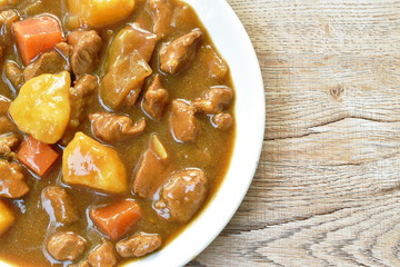 pork with potato and carrot in Japanese curry on plate