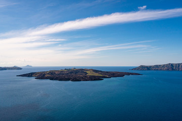 Blue Aegean sea near Greek islands against sky with clouds