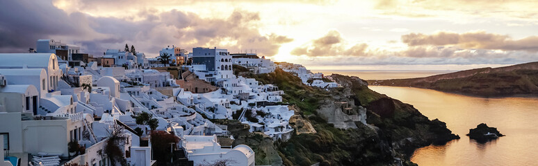 Horizontal image of white houses on Greek island near sea in evening