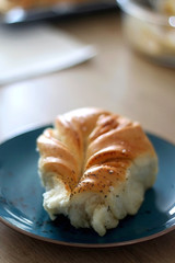 Piece of homemade pull apart bread on a plate. Selective focus.