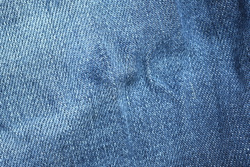 Abstract fabric texture of blue jeans or denim background.