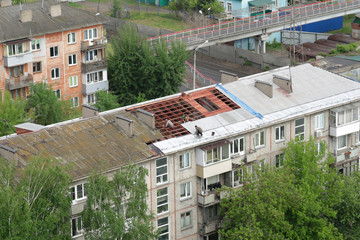 Repair work on the old roof of the house. Workers change the roof and lay slate