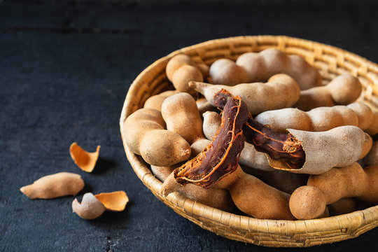 Tamarind in a wooden basket on the table