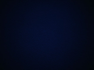 Dark blue texture wall background with darkened edges