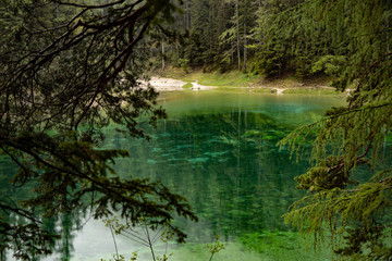 grüner See - green lake Austria with view and clear green water