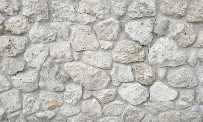 Light stone masonry texture background. Stone wall