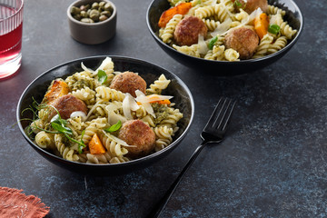 Pasta with meatballs and homemade parsley pesto sauce. Copy space.