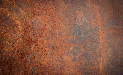 The background image of the iron sheet is rusting caused by prolonged use.Close up of black rust on an old sheet of metal texture.