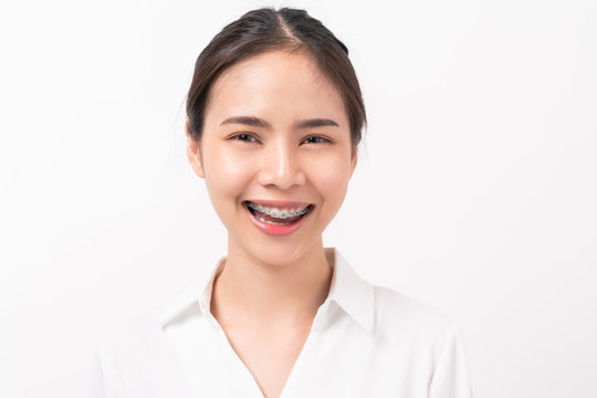 Cheerful beautiful Asian woman stand and smile on white background.