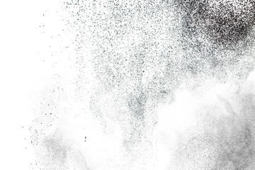 Black powder splatter background.Dust particles texture. Grunge urban backdrop.
