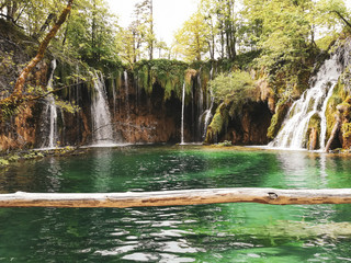 Fototapeta na wymiar Beautiful natural environment of mountain forest waterfalls in preserved eco system of Plitvice lakes national park in Croatia, Unesco world heritage site