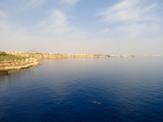 Fototapeta premium View of the Red Sea and the beach. Sharm el Sheikh at the southern tip of the Sinai Peninsula on the Red Sea coast of the Egyptian Riviera.