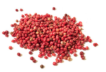 pink peppercorns seeds isolated on white background