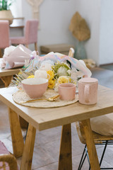 Tasty and healthy breakfast in the cafe. Granola in a pink bowl. Flat lay. Coffee shop concept.