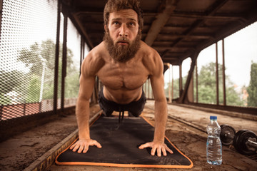 Man working out at old train station