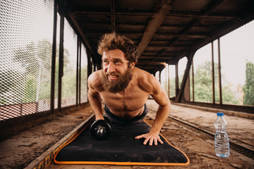 Man working out at old train station
