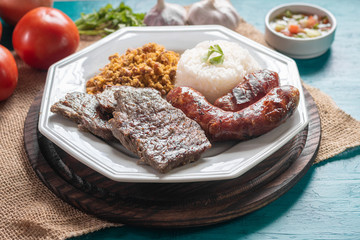 Food plate with barbecue. Brazilian food.