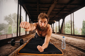 Man working out at old train station
