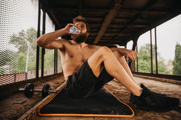 Man working out at old train station
