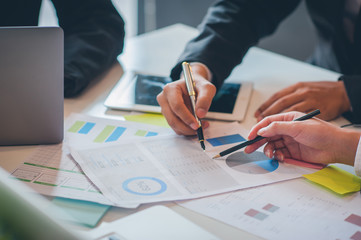 Business people are analyzing and planning business. Business Strategy Consulting
