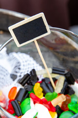 Colored gummy candies in a glass bowl