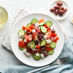 Greek village salad horiatiki with feta cheese, olives, cherry tomato, cucumber and red onion