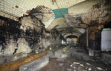 Large antique abandoned cellar of a closed winery