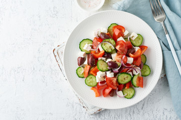 Greek village salad horiatiki with feta cheese, olives, cherry tomato, cucumber and red onion