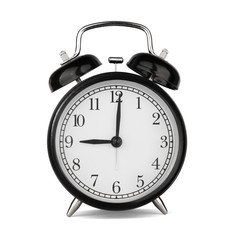 Classic round black metal alarm clock isolated on white background. 9 o'clock