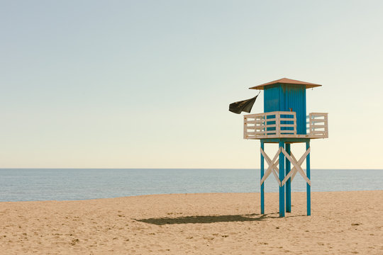 Covid Phase 1 In Málaga, Spain. A Closed And Solitary Beach With Black Flag