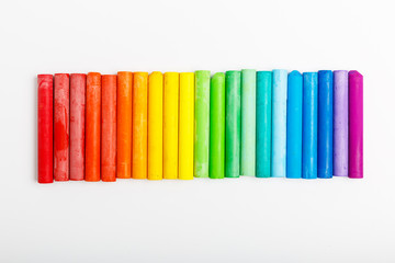 Fototapeta premium multi-colored pastel on a white background. concept of drawing school or art store. colors of rainbow.