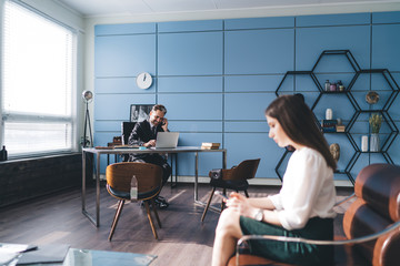 Coworkers working in modern design office