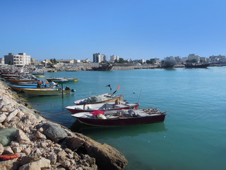Sea boats near waterfront area in Bushehr, Persian Gulf, Iran. It's typical view for Persian sea...
