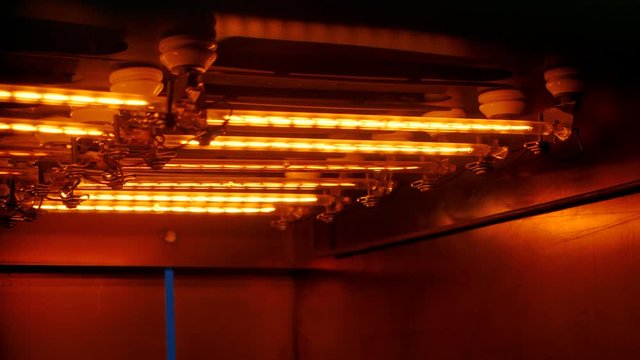 Close-up of heating lamps in an infrared conveyor dryer .