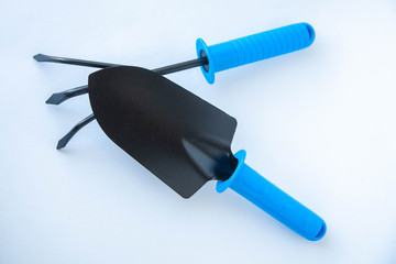 Gardening at home. Growing food on windowsill. Tools, peat pots for seedlings. frame for text, top view. Flatlay on white wooden background
